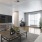 a living room with a large glass coffee table