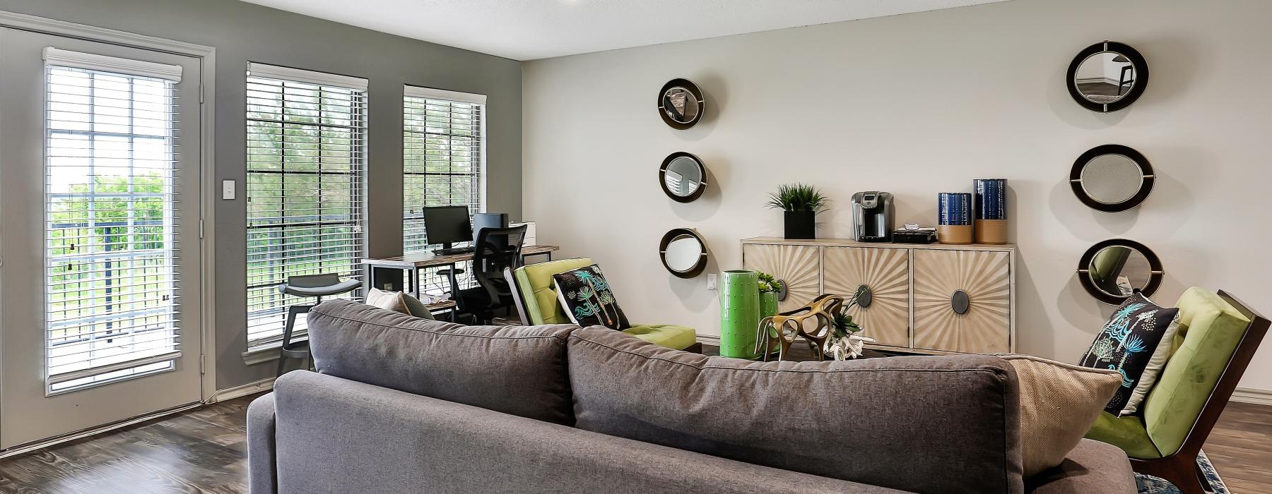 a living room with a couch and a chair