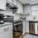 a kitchen with white cabinets