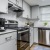 a kitchen with white cabinets